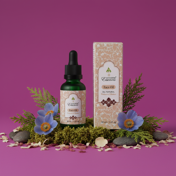 A bottle of facial oil next to its packaging box, styled with blue flowers, moss, pine branches, and small stones on a solid magenta background.