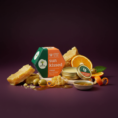 Sun Kissed orange product with honeycomb, oranges, and other ingredients on a dark background