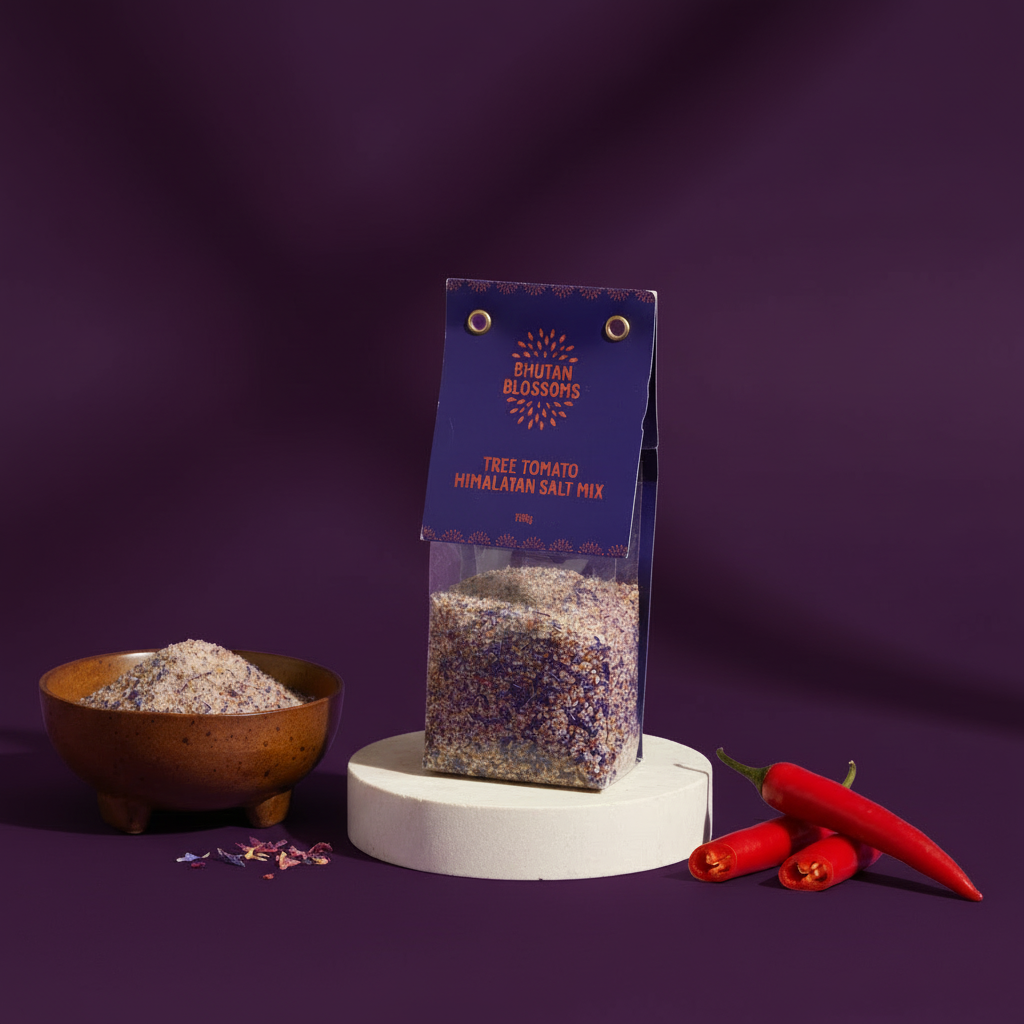 Bhutan Blossoms Himalayan Salt Mix packaging with a bowl of salt and red peppers on a purple background
